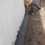 Screening off a sea container. Hollister.